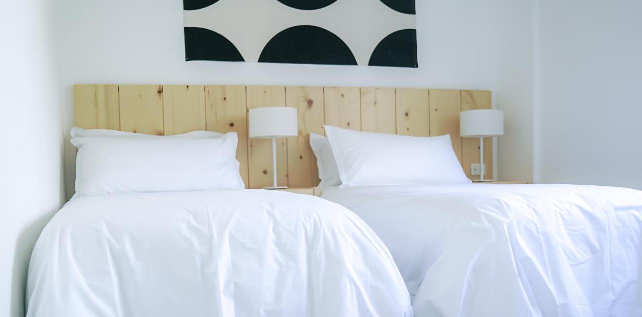 Casagrande Hotel & Beach Club 호세 이그나시오 외부 사진 A bed with white sheets
