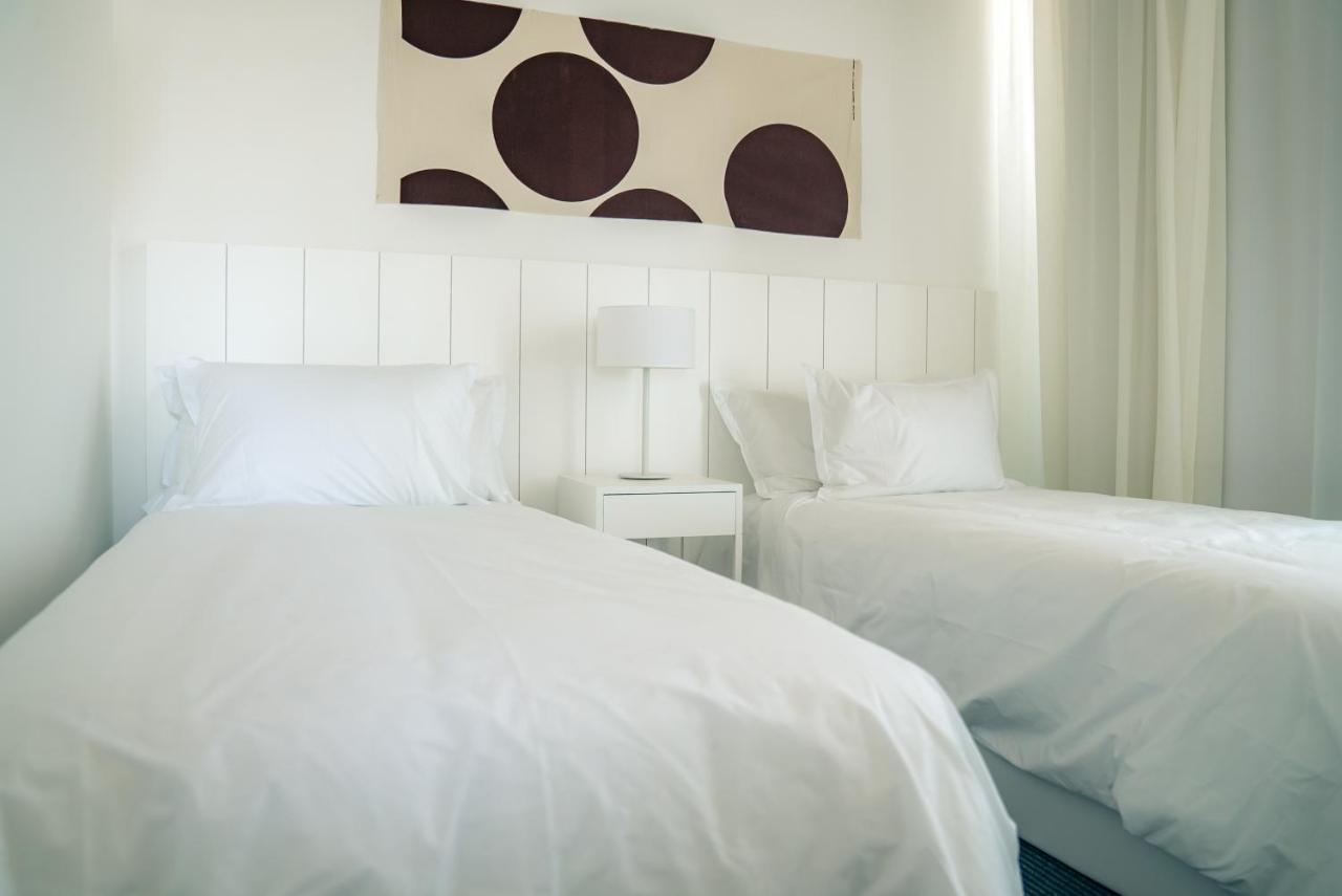 Casagrande Hotel & Beach Club 호세 이그나시오 외부 사진 A bedroom with two single beds